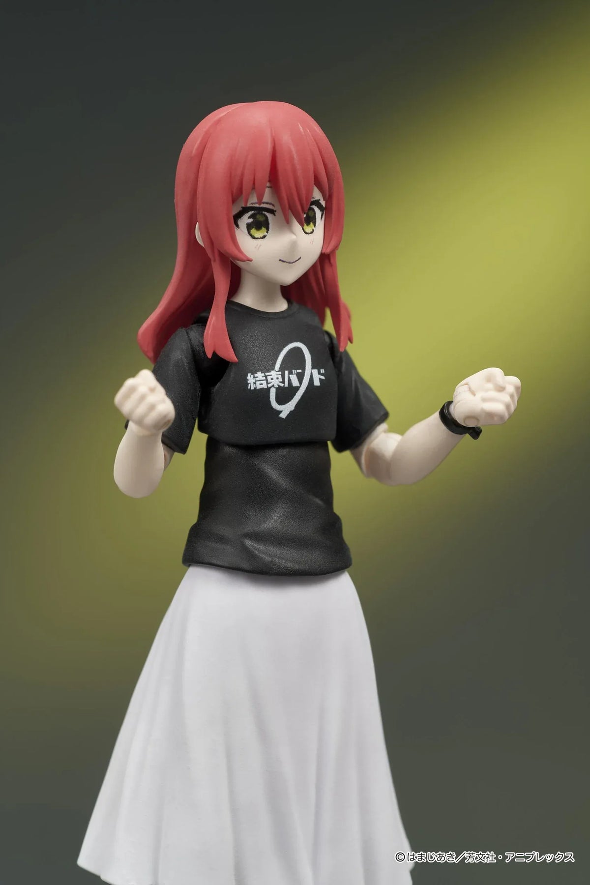 Bocchi the Rock! DIGACTION Ikuyo Kita figure winking while holding a light blue guitar, wearing a black band T-shirt and white pleated skirt.
