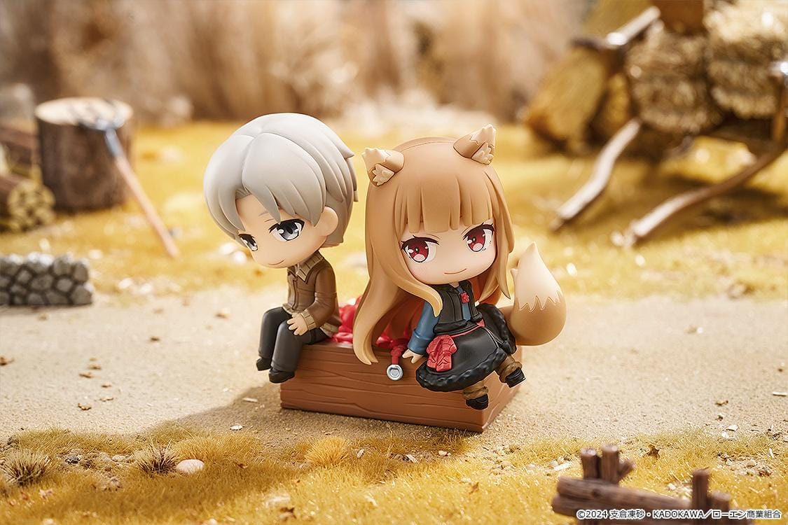 Spice and Wolf Mini Memory Lawrence and Holo chibi figure set sitting on a wooden crate base