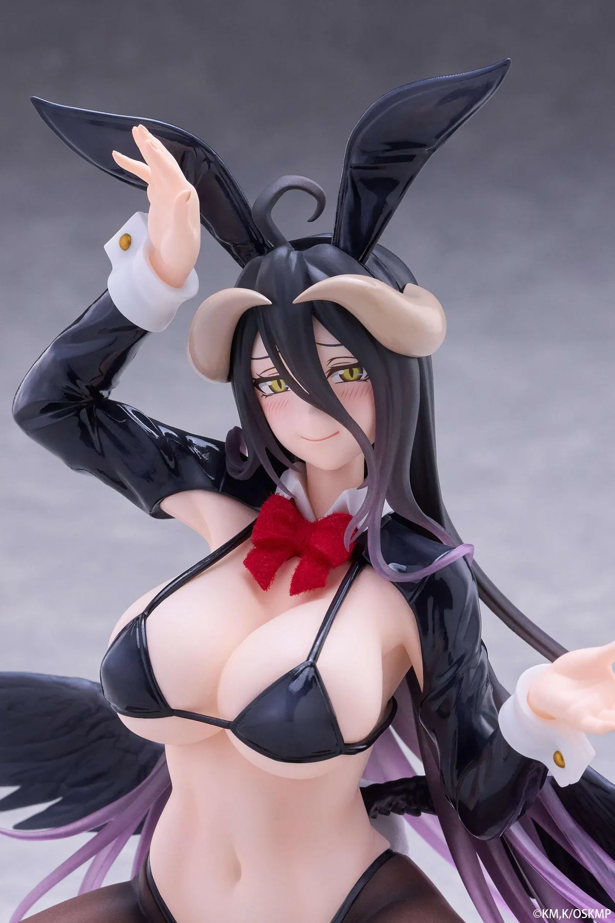 Albedo MOFLOCK Reverse Bunny Suit figure wearing a glossy black outfit with bunny ears, sheer stockings, horns, and black wings.