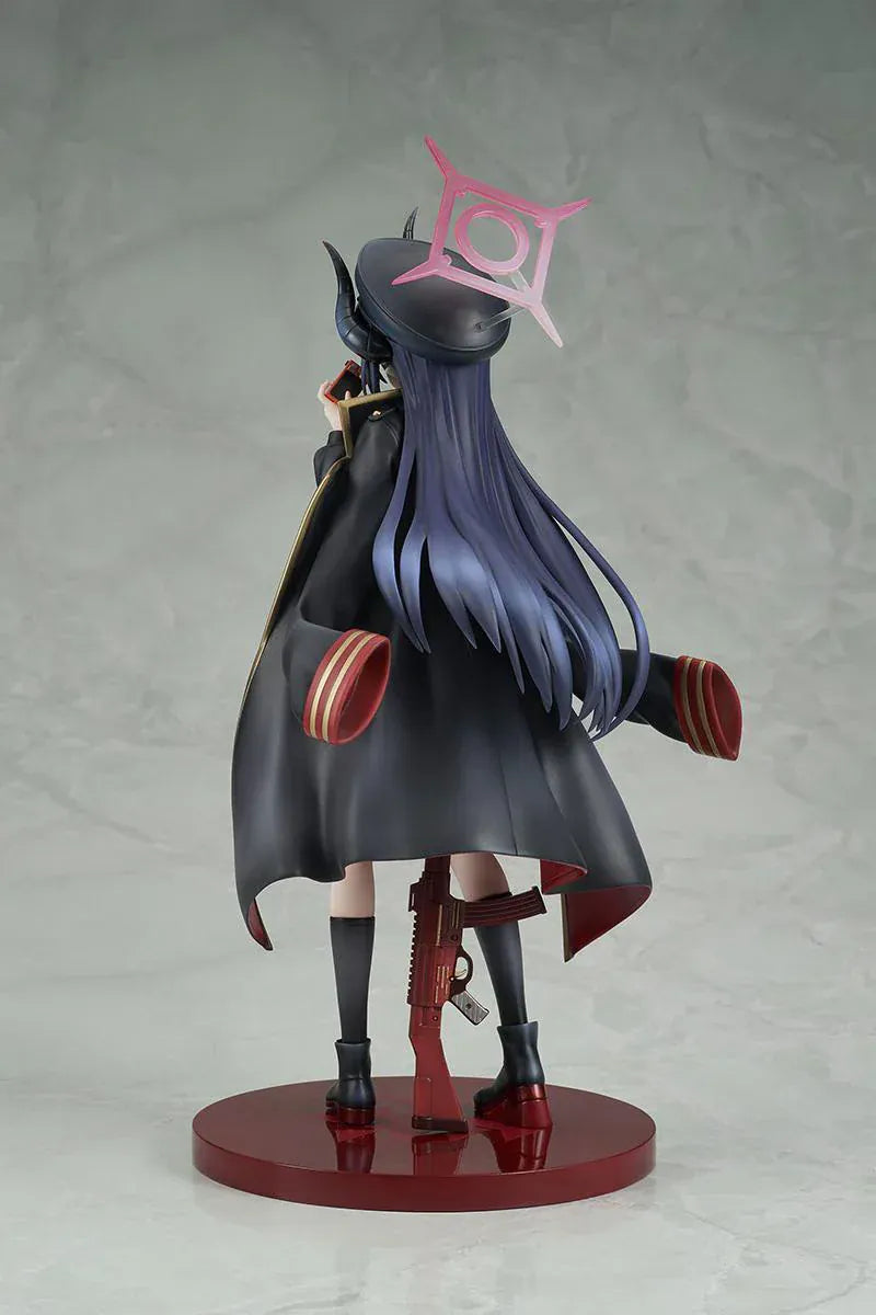 Blue Archive Chiaki 1/7 scale figure wearing dark uniform with long coat holding camera and rifle accessory.
