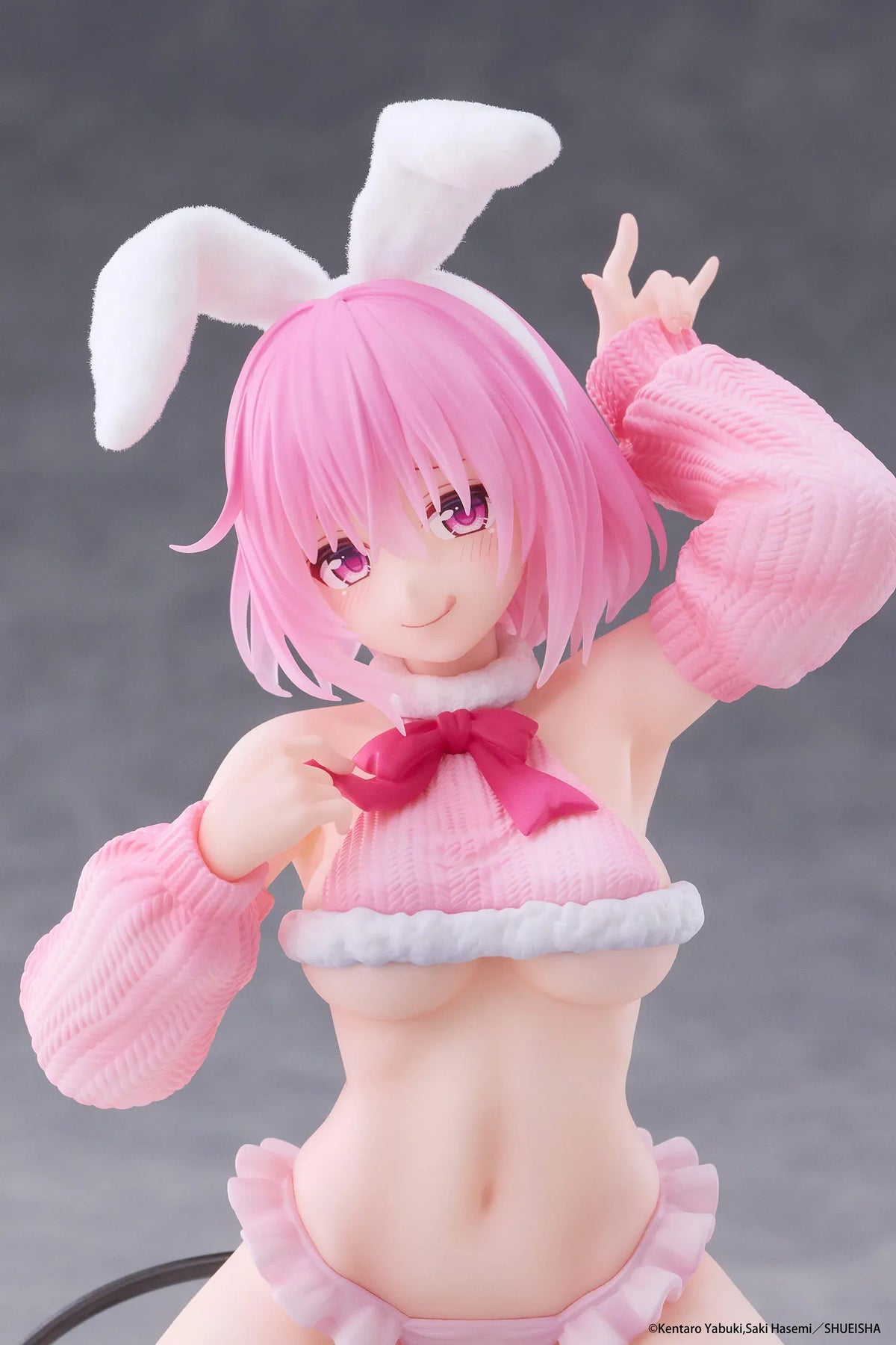 To Love-Ru Darkness MOFLOCK Momo Fluffy Bunny Ver. Figure featuring a pink-haired anime girl with pink eyes, white bunny ears, a pink fluffy bunny outfit, matching sleeves, white thigh-high stockings, and a black devil tail in a playful kneeling pose.