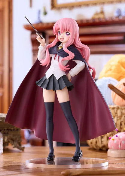 POP UP PARADE Louise L Size figure with flowing pink hair, a raised wand, white blouse, dark skirt, and a cape with burgundy lining.