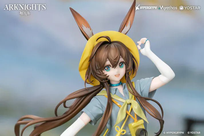 Arknights Gift+ Amiya Wildlight Wander Ver. 1/8 Scale Figure featuring Amiya with rabbit ears, hooded outfit, camera accessory, yellow bag, and themed display base.