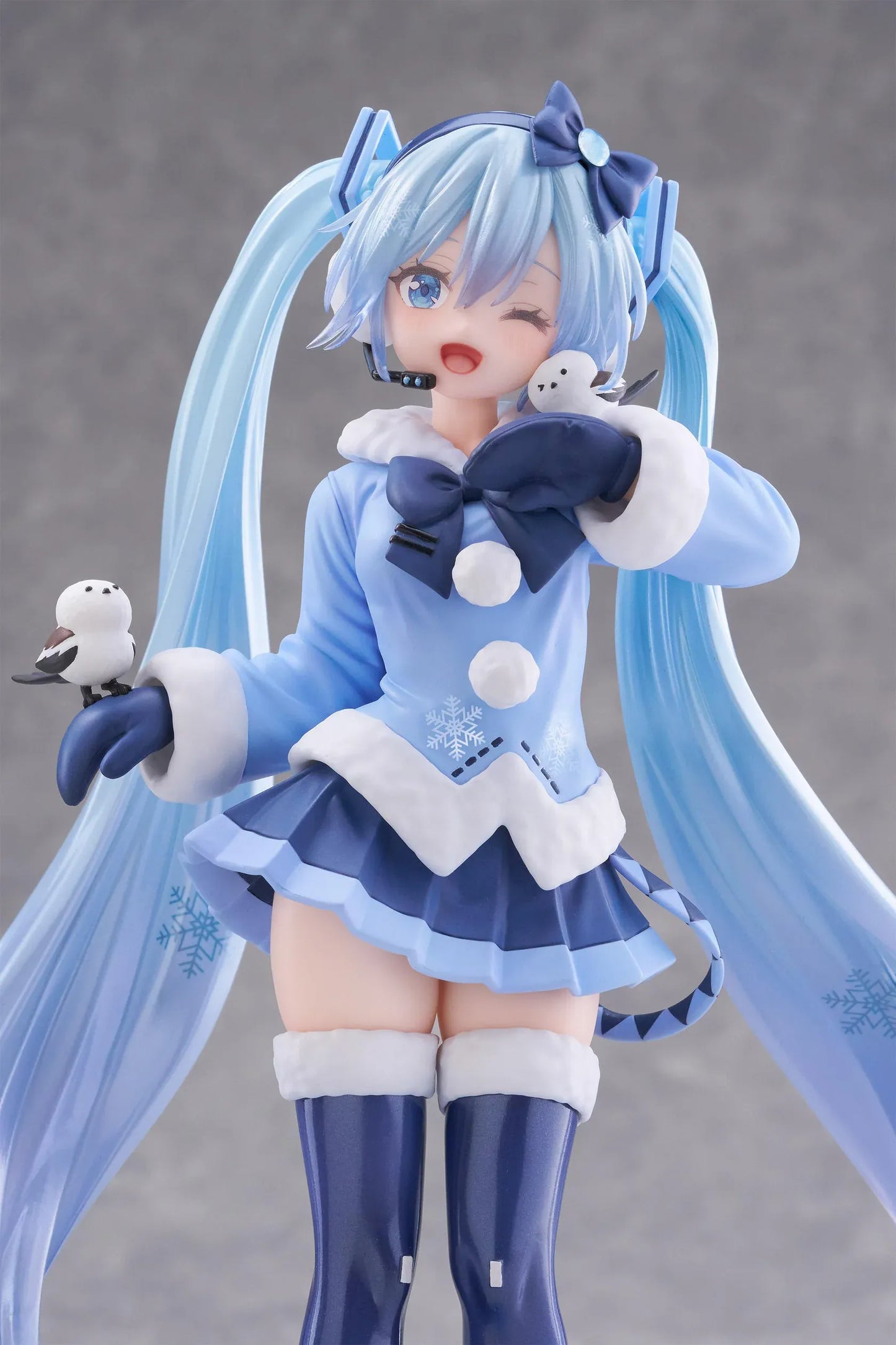 Vocaloid AMP+ Snow Miku All Stars 2012 Ver. Figure with icy blue twin-tails, winter outfit, bird details, and snowflake display base