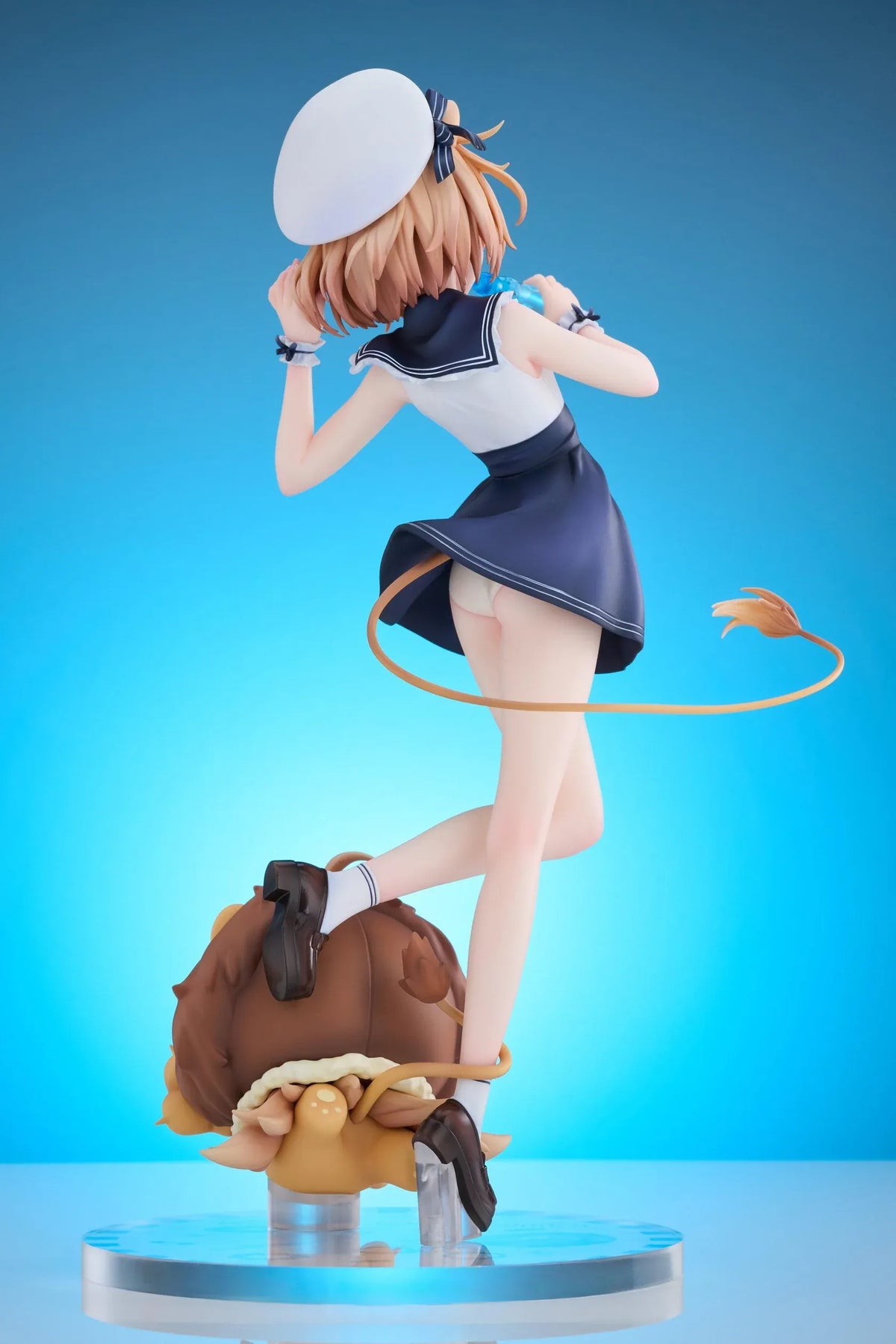 Rurudo Lion Marine Sailor Ver. figure in a navy and white sailor dress and hat, holding a blue bottle beside a chibi lion companion.