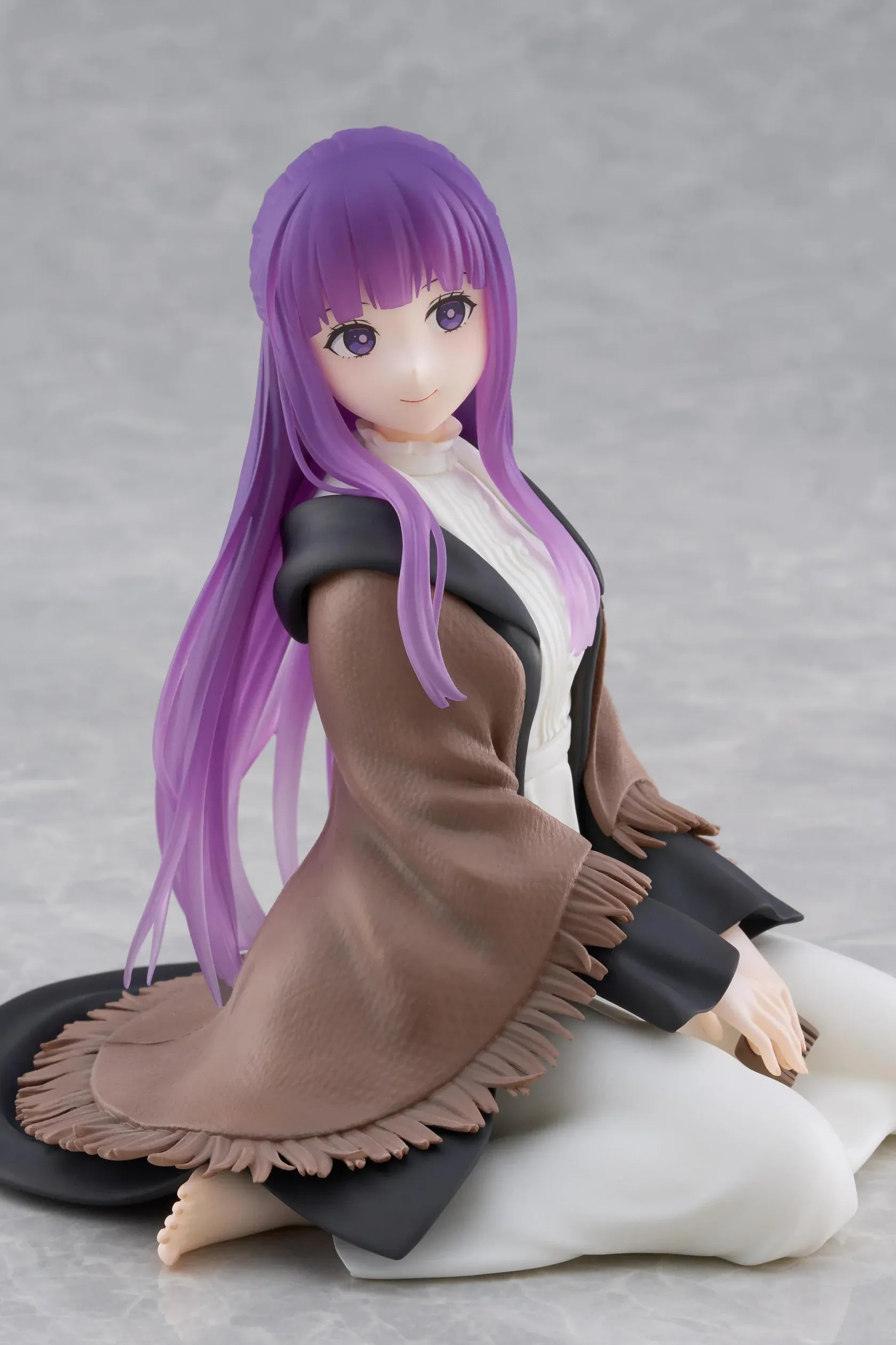 Frieren Beyond Journey's End Desktop Cute Fern Figure with purple hair wearing a shawl and white dress in a seated pose