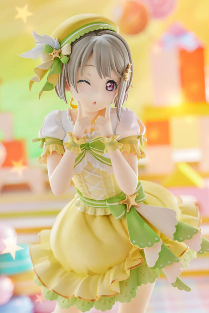 Love Live Nijigasaki High School Idol Club Kasumi Nakasu 1/7 Scale Figure featuring Kasumi in a yellow and green idol outfit with a winking expression, ribbon accents, and matching boots.