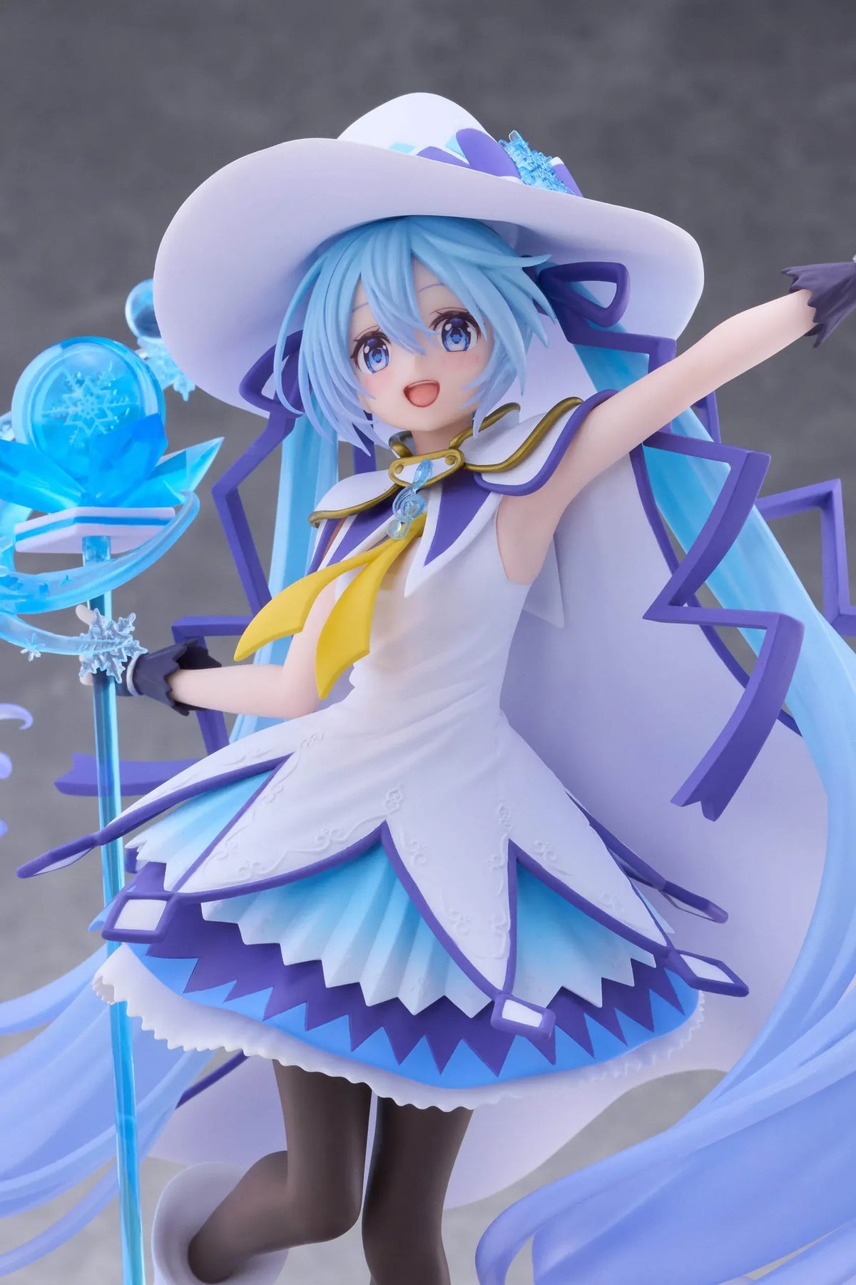 Snow Miku All Stars 2014 Ver. AMP+ figure wearing a white-and-blue snow sorceress outfit and holding a translucent magical staff.