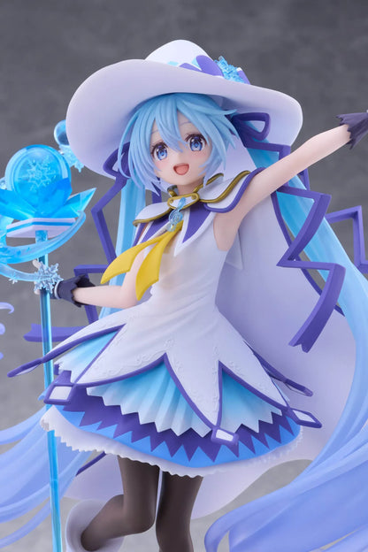 Snow Miku All Stars 2014 Ver. AMP+ figure wearing a white-and-blue snow sorceress outfit and holding a translucent magical staff.