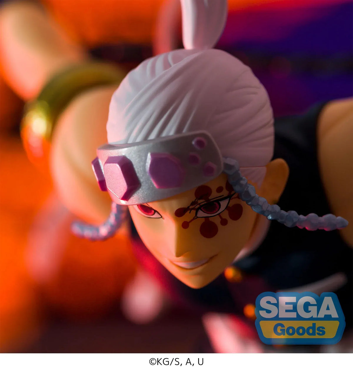 Demon Slayer FIGURIZMα Tengen Uzui figure in a wide stance with twin chained blades extended, a jeweled headband, and gold arm bands on a white base.
