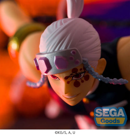 Demon Slayer FIGURIZMα Tengen Uzui figure in a wide stance with twin chained blades extended, a jeweled headband, and gold arm bands on a white base.