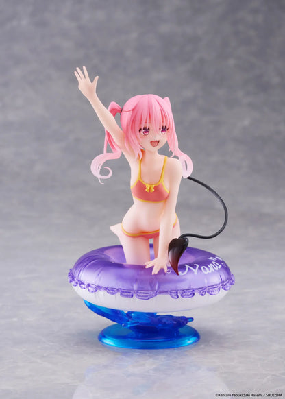 To Love-Ru Darkness Aqua Float Girls Nana figure featuring Nana with pink twin tails in a swimsuit posing on a purple float ring display base
