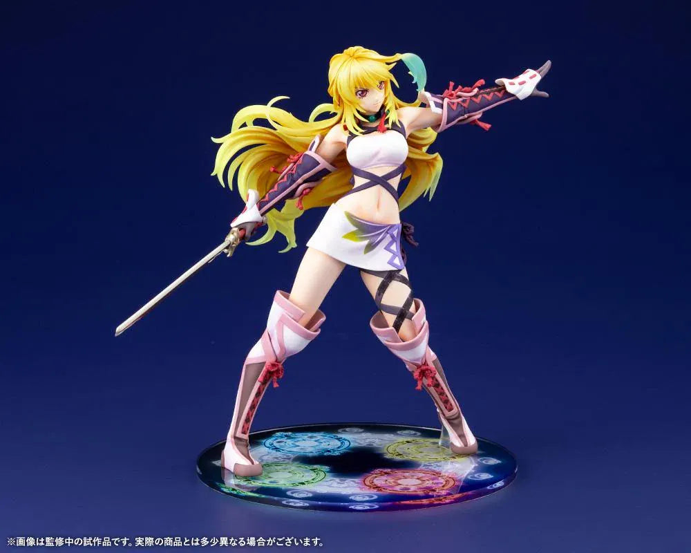 Tales of Xillia Milla Maxwell 1/8 scale figure holding a sword in a battle pose on a colorful elemental display base.