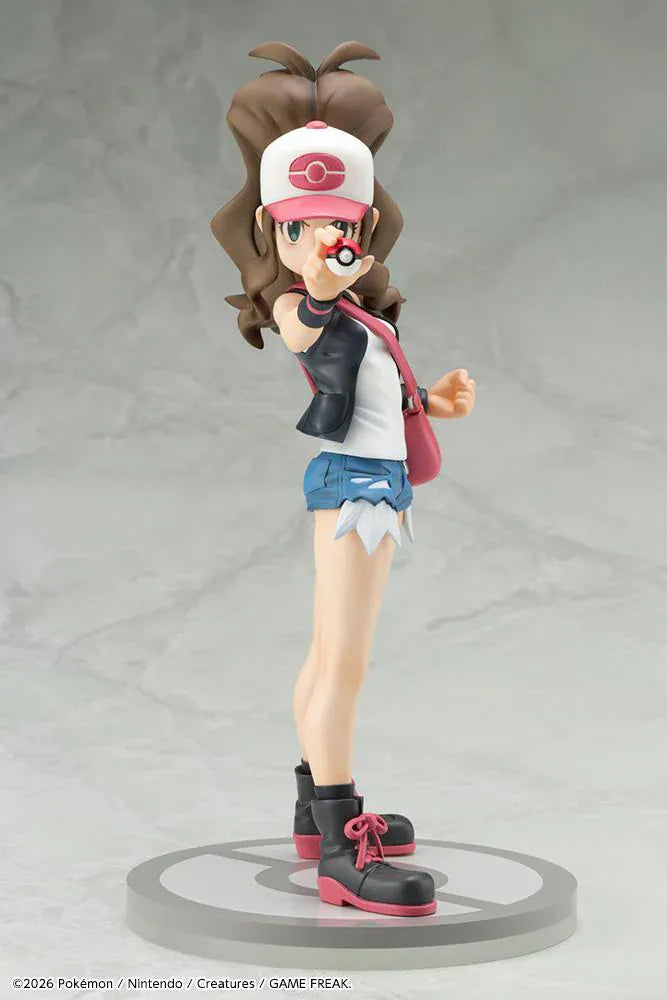 Pokemon ArtFX J Hilda with Tepig 1/8 Scale Figure Rerun featuring Hilda in her trainer outfit holding a Poké Ball with Tepig and flame effect on a display base.