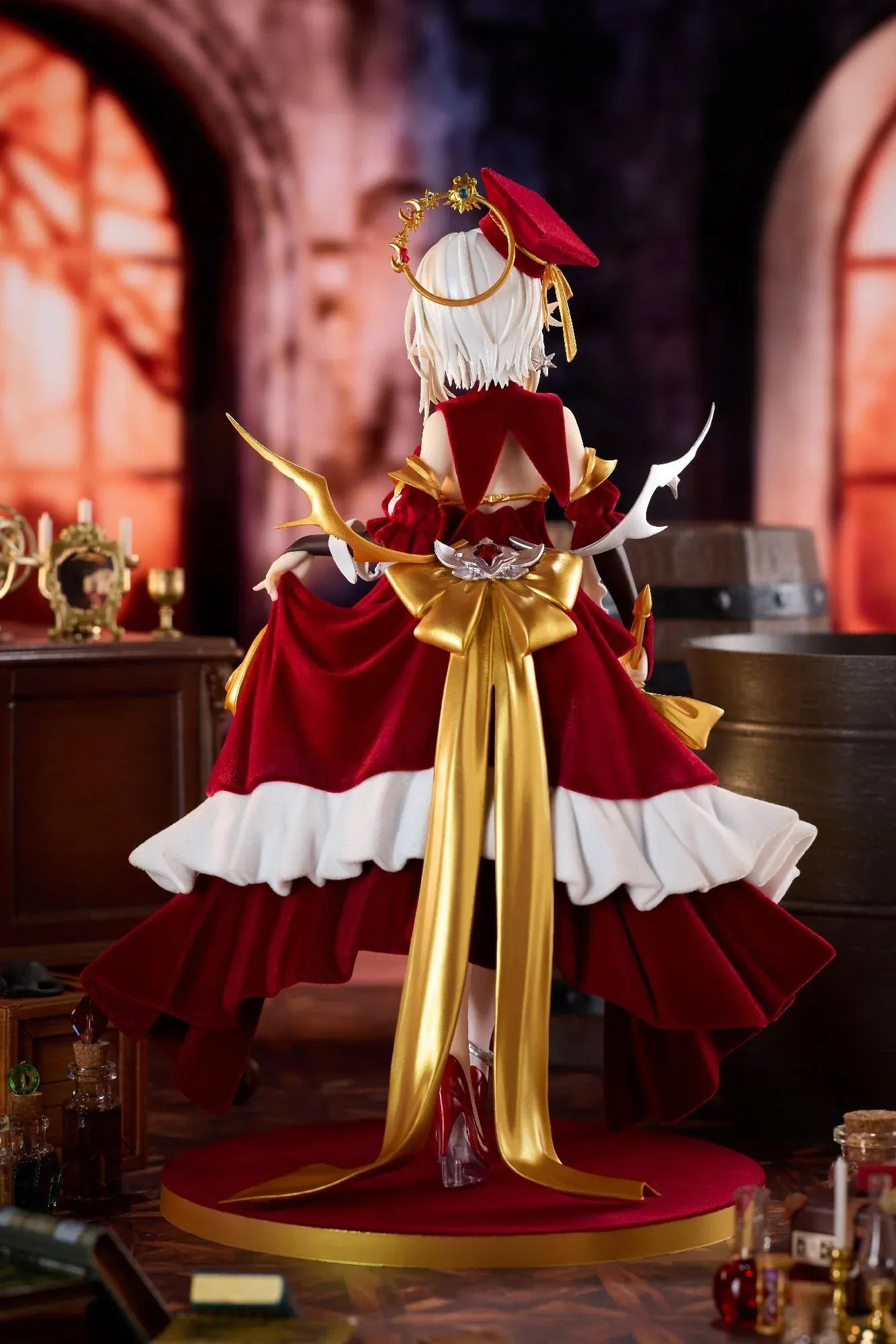 Alchemist Formal Dress Ver. 1/7 Scale Figure featuring a white-haired character in a red formal dress with gold accessories, ornate staff, cape, and red display base.