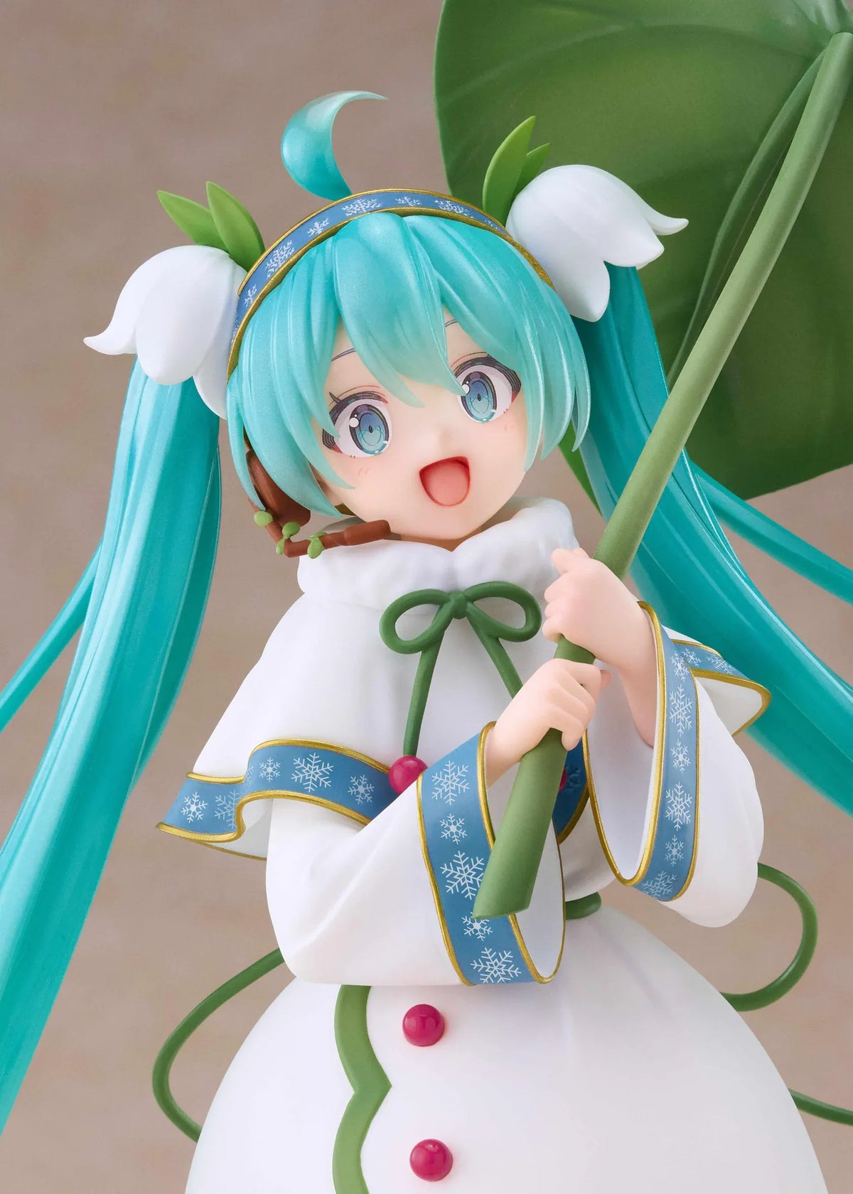 Snow Miku All Stars 2015 Ver. AMP+ figure wearing a white flower-inspired dress and holding an oversized green leaf.