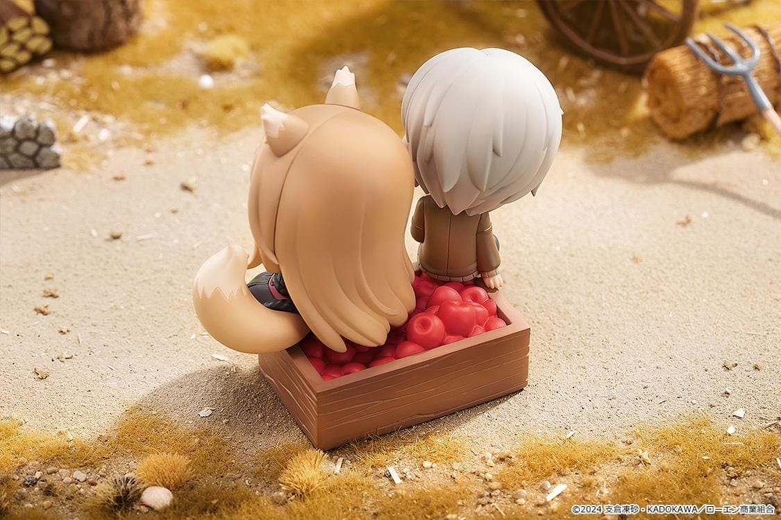 Spice and Wolf Mini Memory Lawrence and Holo chibi figure set sitting on a wooden crate base