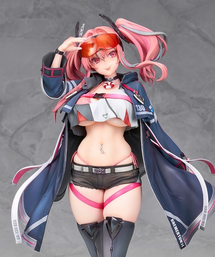 Azur Lane Bremerton 1/7 scale figure with pink twin tails, orange goggles, a navy coat, black shorts, and tall boots in a saluting pose.