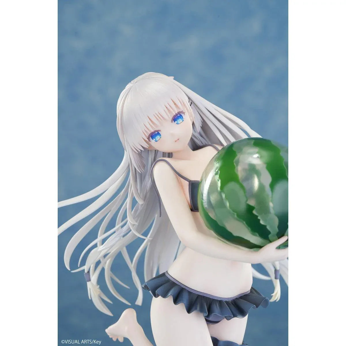 Summer Pockets REFLECTION BLUE Shiroha Naruse 1/6 scale figure wearing a black swimsuit and holding a watermelon on a beach-themed base.