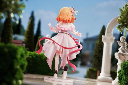 Is the Order a Rabbit Cocoa Dress Ver. 1/7 Scale Figure wearing an elegant pink and white frilled dress with ribbons and floral accessories
