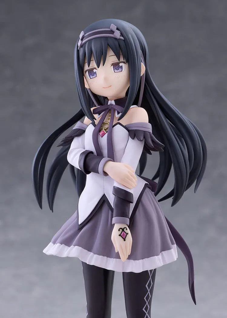 Homura Akemi figure with long black hair, violet eyes, a white and purple outfit, and diamond-patterned stockings, smiling with one hand resting on her arm.