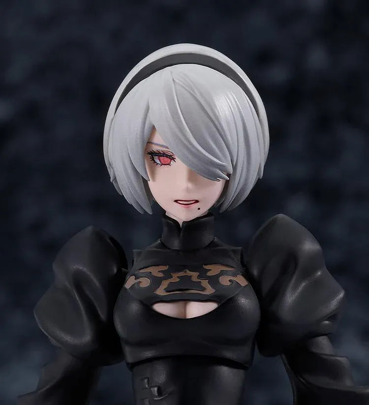 NieR Ver1.1a figma 2B figure with silver hair, a black visor, patterned black outfit, white sleeves, glossy boots, and a support robot.
