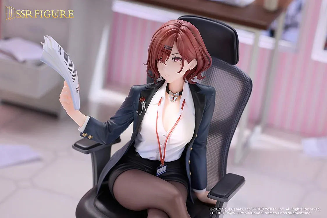 Madoka Higuchi Effortless Work Ver. figure seated in an office chair, wearing a navy blazer and holding papers above a clear circular base.