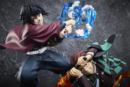 Demon Slayer Tanjiro Kamado, Giyu Tomioka, and Akaza vignette figure featuring translucent water and fire battle effects.
