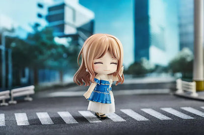Nendoroid figure of Soyo Nagasaki from BanG Dream! holding a sunburst bass guitar, wearing a blue dress with a white skirt and black shoes.