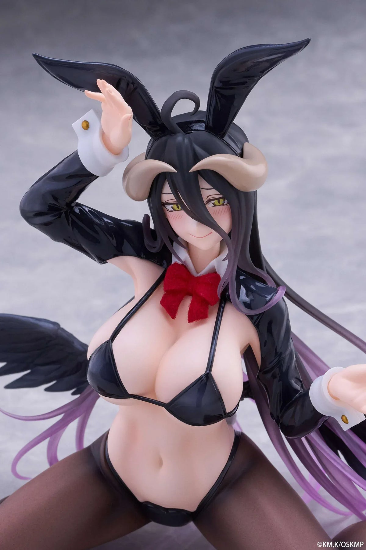 Albedo MOFLOCK Reverse Bunny Suit figure wearing a glossy black outfit with bunny ears, sheer stockings, horns, and black wings.