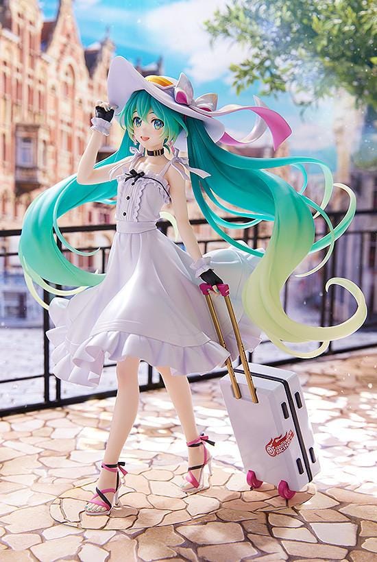 Racing Miku 2021 Private Ver. figure in a white dress and wide-brimmed hat, with turquoise twin-tails and a rolling suitcase on a stone-style base.