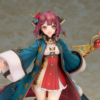 Sophie Neuenmuller figure smiling in a dynamic pose, wearing a teal coat over a red outfit and holding an ornate gold staff with a red orb.