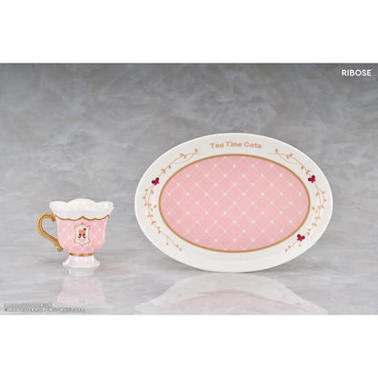 DLC Series Tea Time Cats Orange Cat Non Scale Figure by RIBOSE featuring an orange-haired cat girl with green eyes, a pink outfit, fluffy cat ears, and paw-shaped sleeves sitting beside a decorative pink teacup on a matching serving tray.