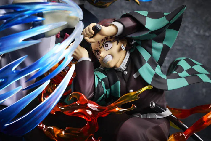 Demon Slayer Tanjiro Kamado, Giyu Tomioka, and Akaza vignette figure featuring translucent water and fire battle effects.