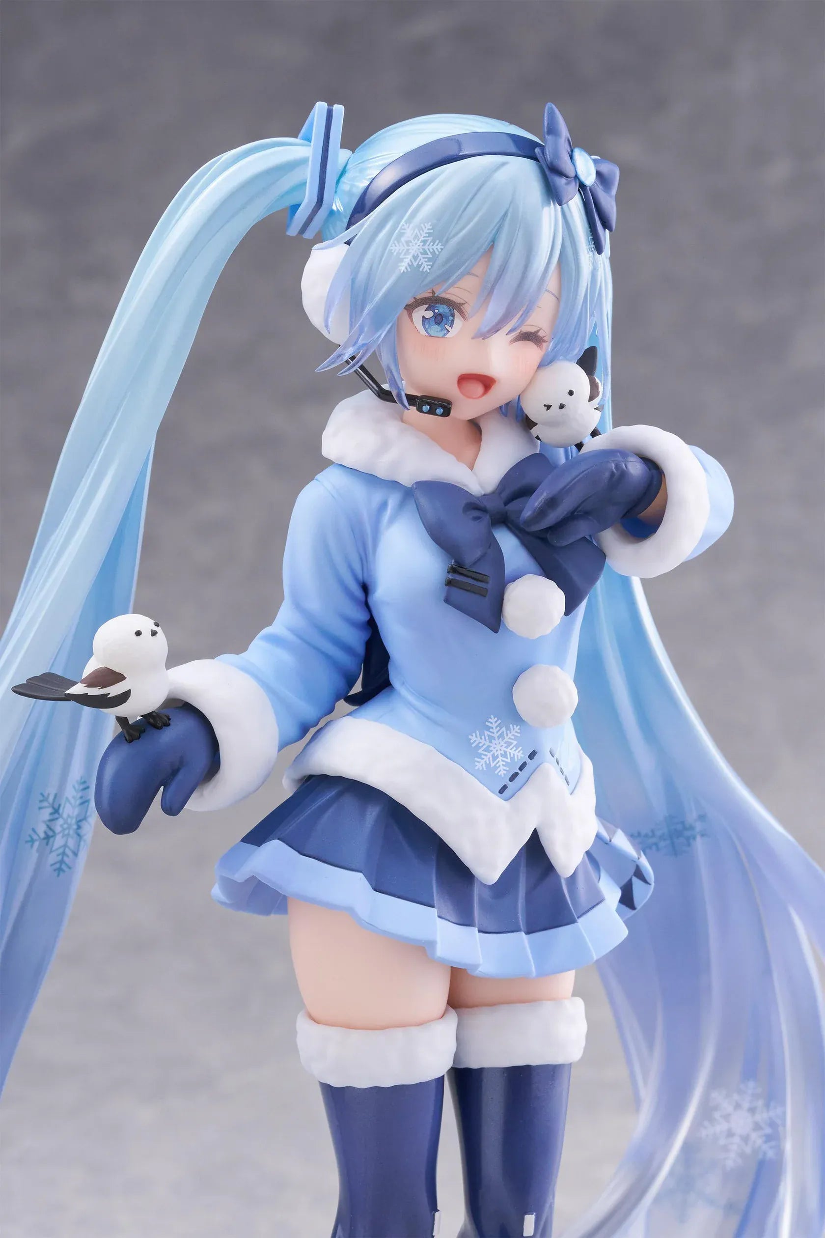 Vocaloid AMP+ Snow Miku All Stars 2012 Ver. Figure with icy blue twin-tails, winter outfit, bird details, and snowflake display base