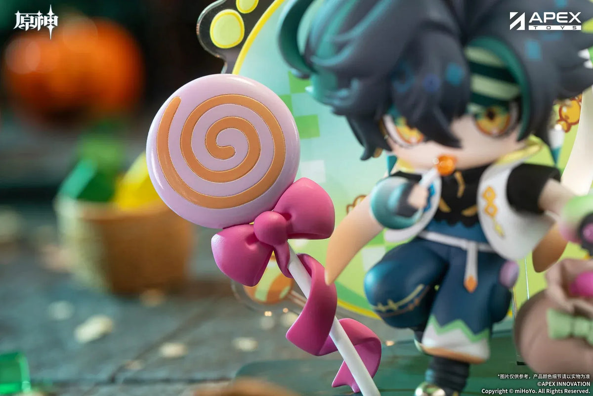 Genshin Impact You Ye Qi Xiang Series chibi Kinich figure holding a lollipop, surrounded by candy, a pumpkin, and a pixel-art backdrop.