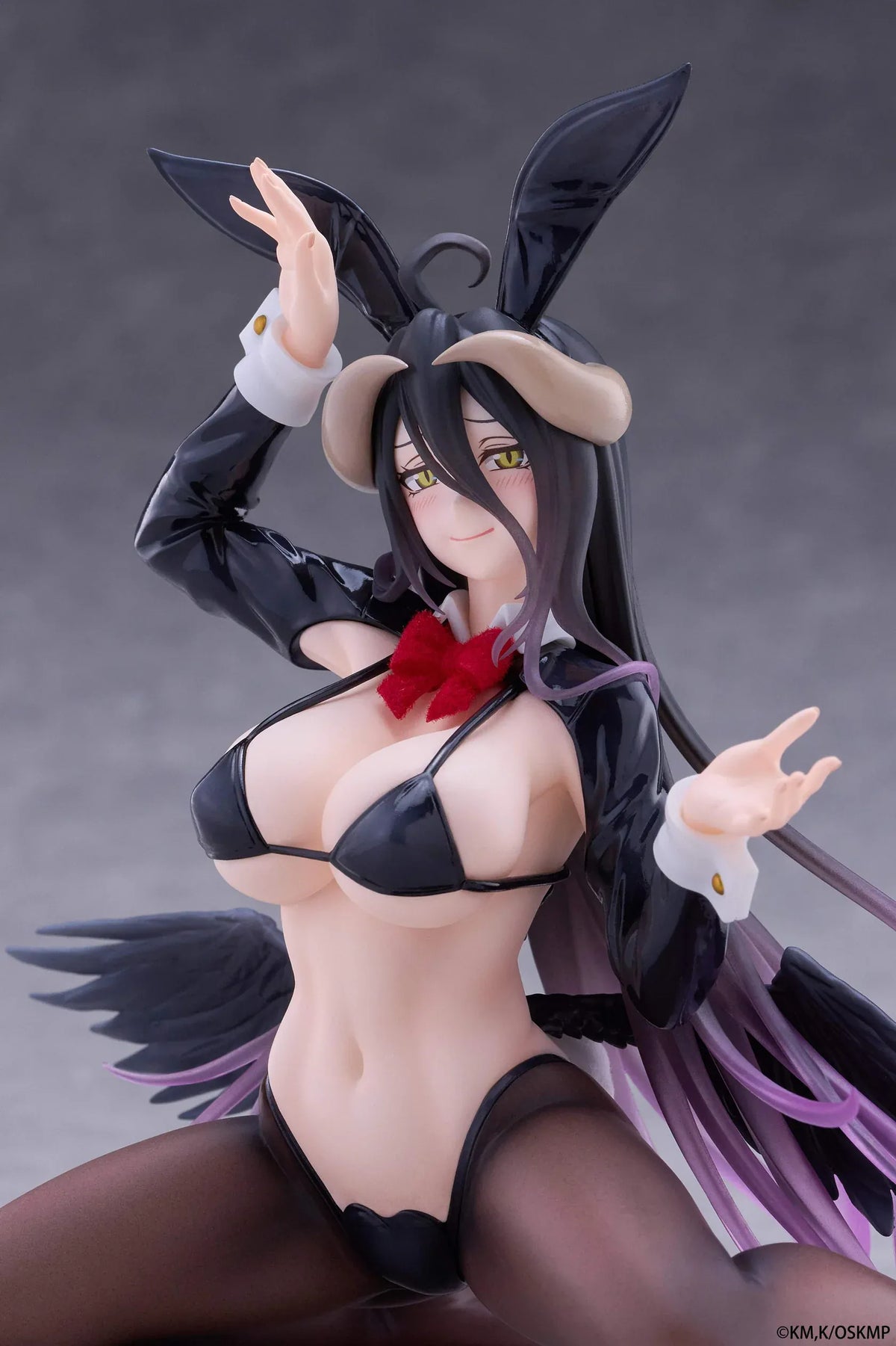 Albedo MOFLOCK Reverse Bunny Suit figure wearing a glossy black outfit with bunny ears, sheer stockings, horns, and black wings.