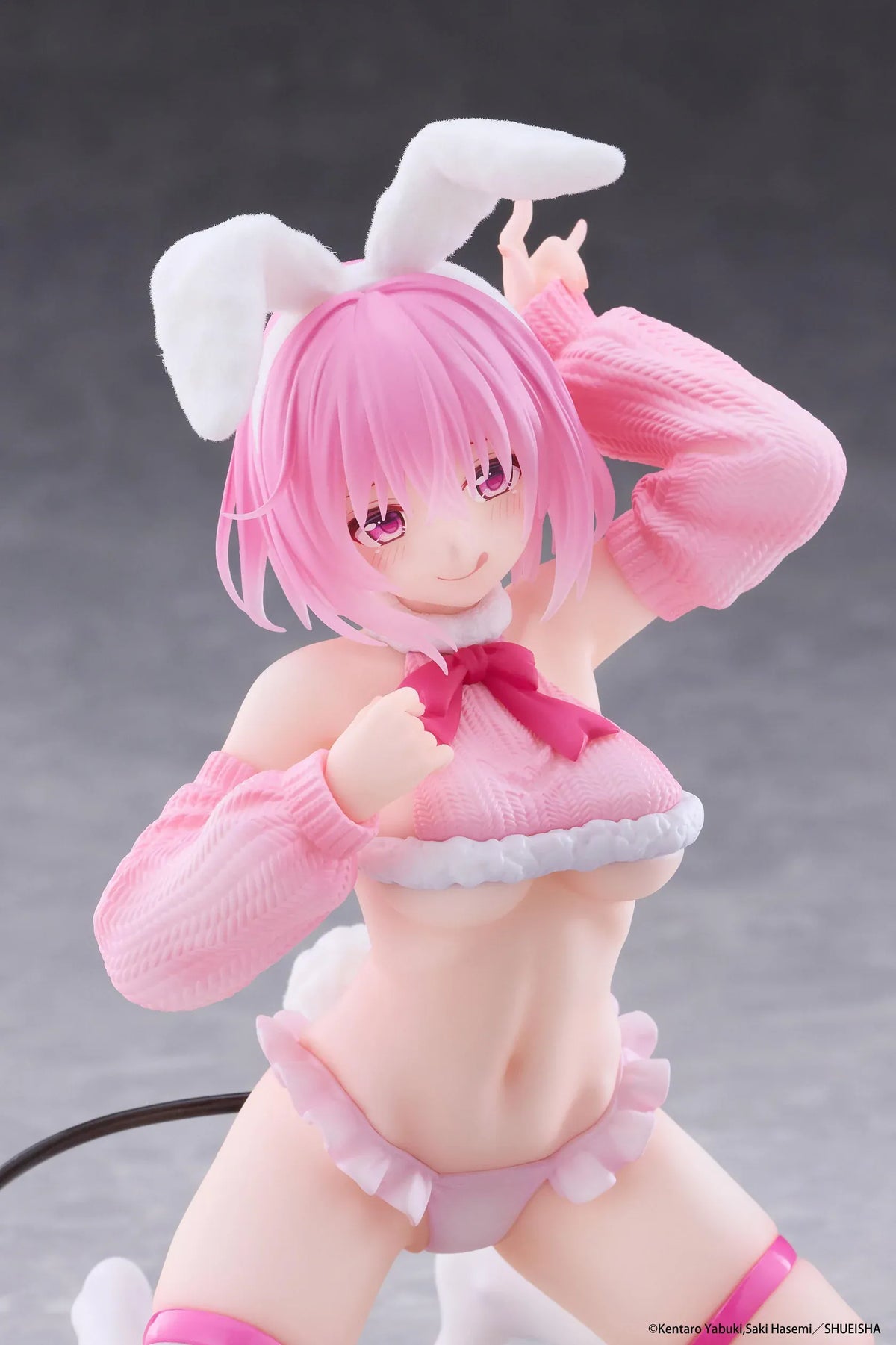 To Love-Ru Darkness MOFLOCK Momo Fluffy Bunny Ver. Figure featuring a pink-haired anime girl with pink eyes, white bunny ears, a pink fluffy bunny outfit, matching sleeves, white thigh-high stockings, and a black devil tail in a playful kneeling pose.