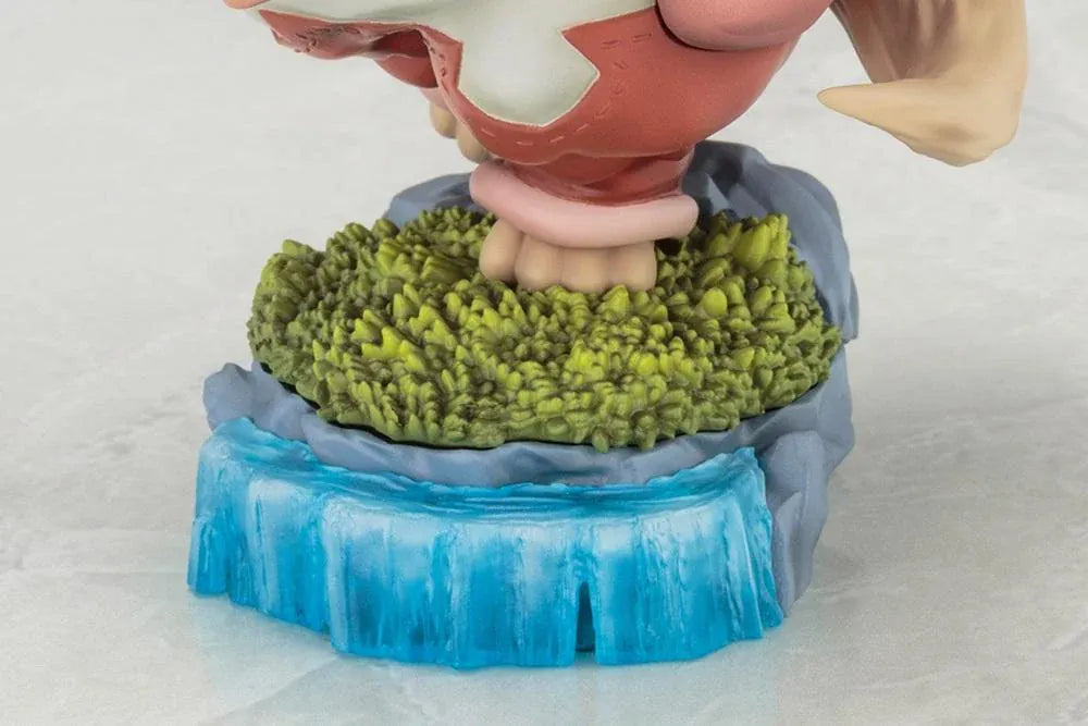 Made in Abyss The Awakening Mystery Nanachi Figure (Rerelease) featuring a fluffy rabbit-like character with long cream-colored ears, golden eyes, an oversized explorer hat, pink and beige clothing, and long flowing hair standing on a detailed scenic base with green moss, rocks, and blue water.