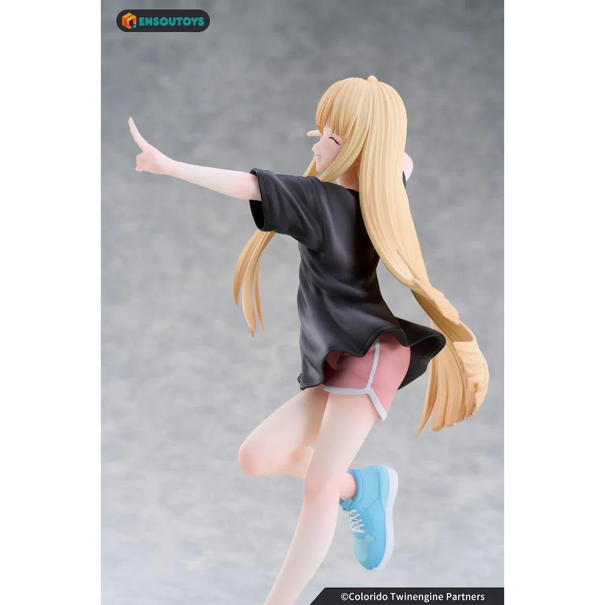 Kaguya In the Real World Ver. 1/7 scale figure with flowing blonde hair, a black outfit, blue sneakers, and a winking peace-sign pose.