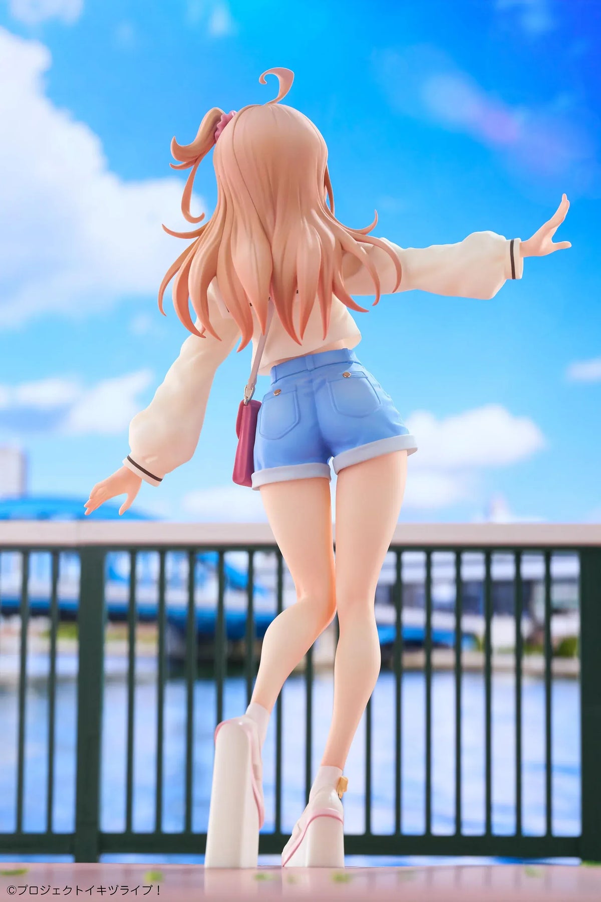 Polka Takahashi 1/7 scale figure with orange hair, a white sailor-style top, blue shorts, and a pink shoulder bag, posed on a yellow base.