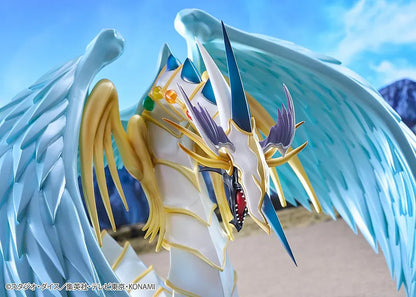 Yu-Gi-Oh! GX Rainbow Dragon figure with a pearlescent armored body, multicolored crystals, gold accents, and translucent blue wings.