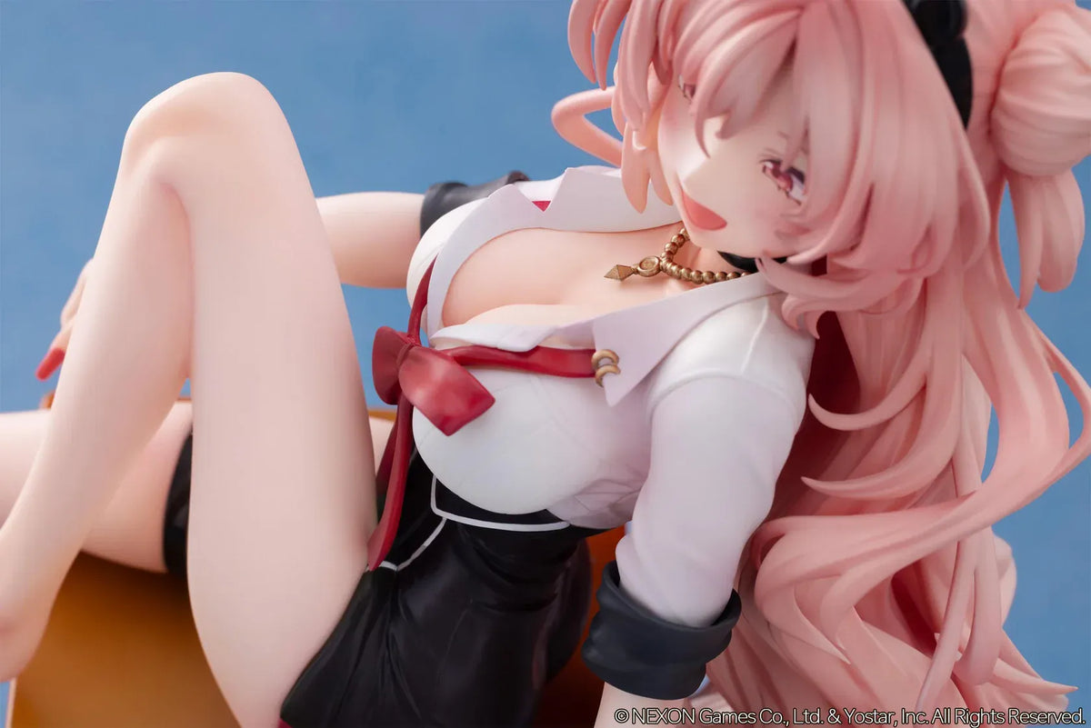 Blue Archive Kirara figure with long pink hair, black horns, and a pink halo, seated on a classroom desk beside nail polish bottles.
