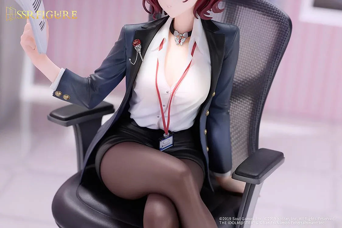 Madoka Higuchi Effortless Work Ver. figure seated in an office chair, wearing a navy blazer and holding papers above a clear circular base.