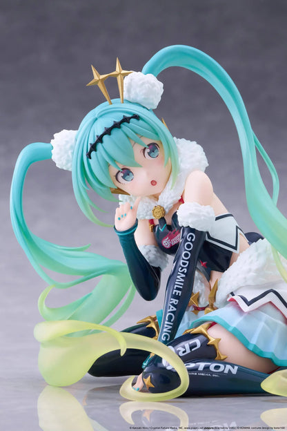Racing Miku 2018 Ver. Round 8 figure seated in a white, black, and turquoise racing outfit with long gradient twin tails.