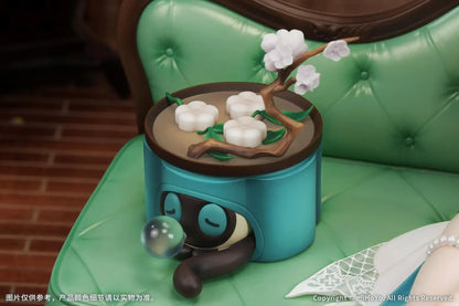 Ruan Mei Plumblossom Letter 1/7 scale figure wearing an elegant teal-and-white floral dress while seated on an ornate green sofa.