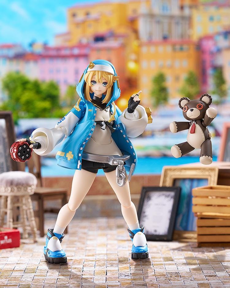 GUILTY GEAR STRIVE figma Bridget Figure featuring Bridget in a blue hoodie outfit with yo-yo accessory, oversized handcuff detail, and teddy bear companion.