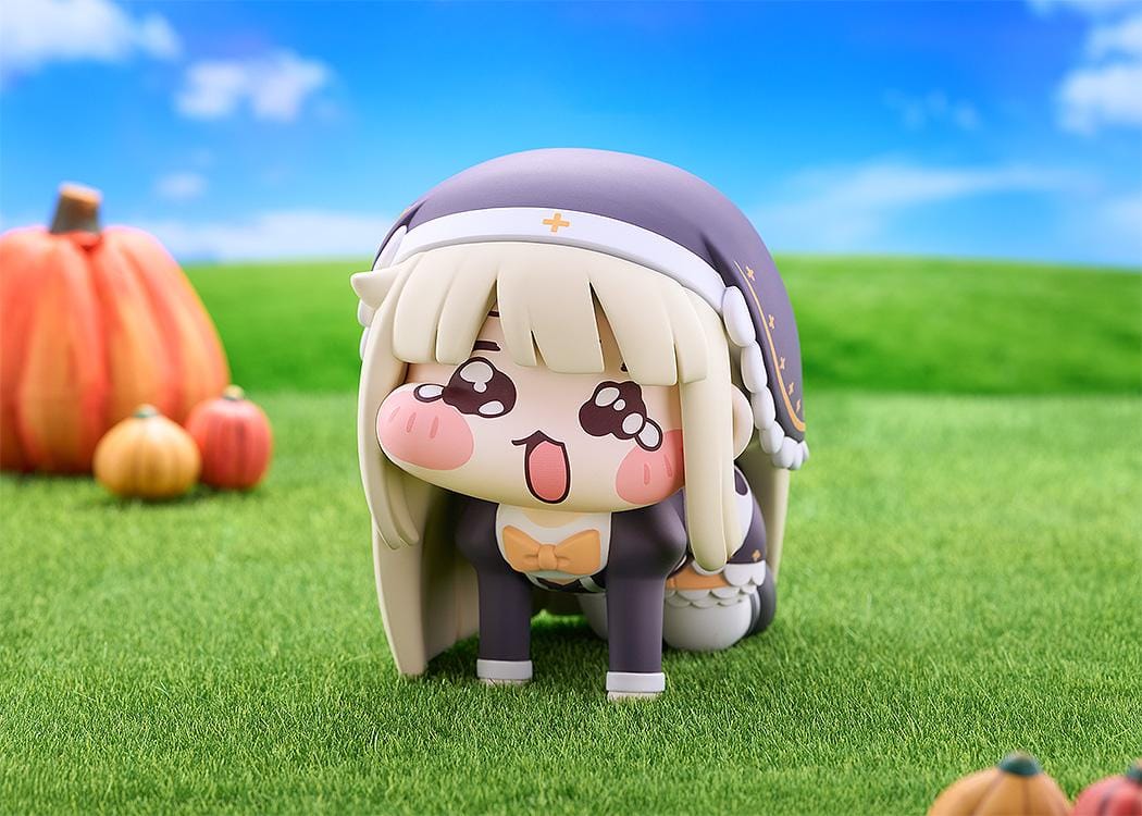 Petite Speaki soft vinyl figure with blonde hair, rosy cheeks, sparkling eyes, and a dark hood with gold accents.