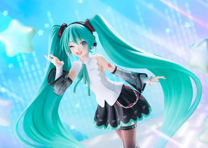 Vocaloid T-Most Hatsune Miku NT Ver. Figure featuring Miku with long teal twin tails, headphones, black-and-white outfit, wink expression, peace-sign pose, and star-themed base.