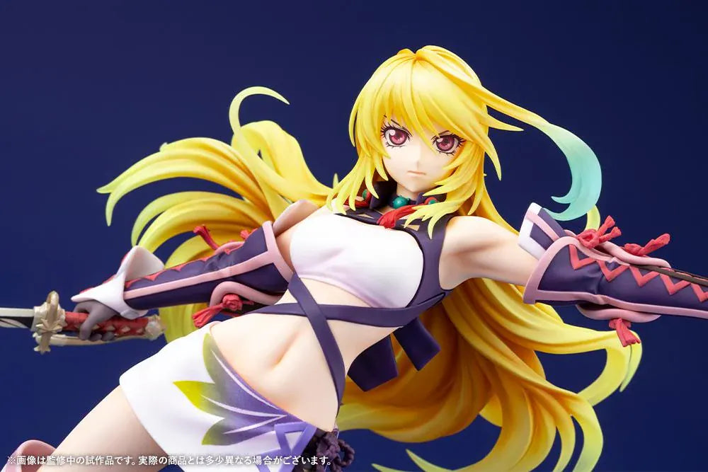 Tales of Xillia Milla Maxwell 1/8 scale figure holding a sword in a battle pose on a colorful elemental display base.